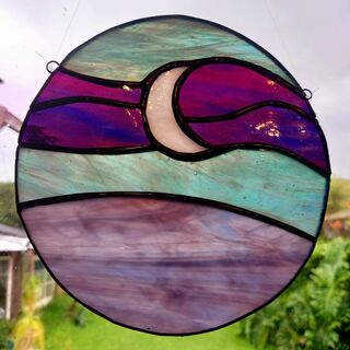 Moon over purple sea