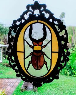 staghorn beetle in gothic frame
